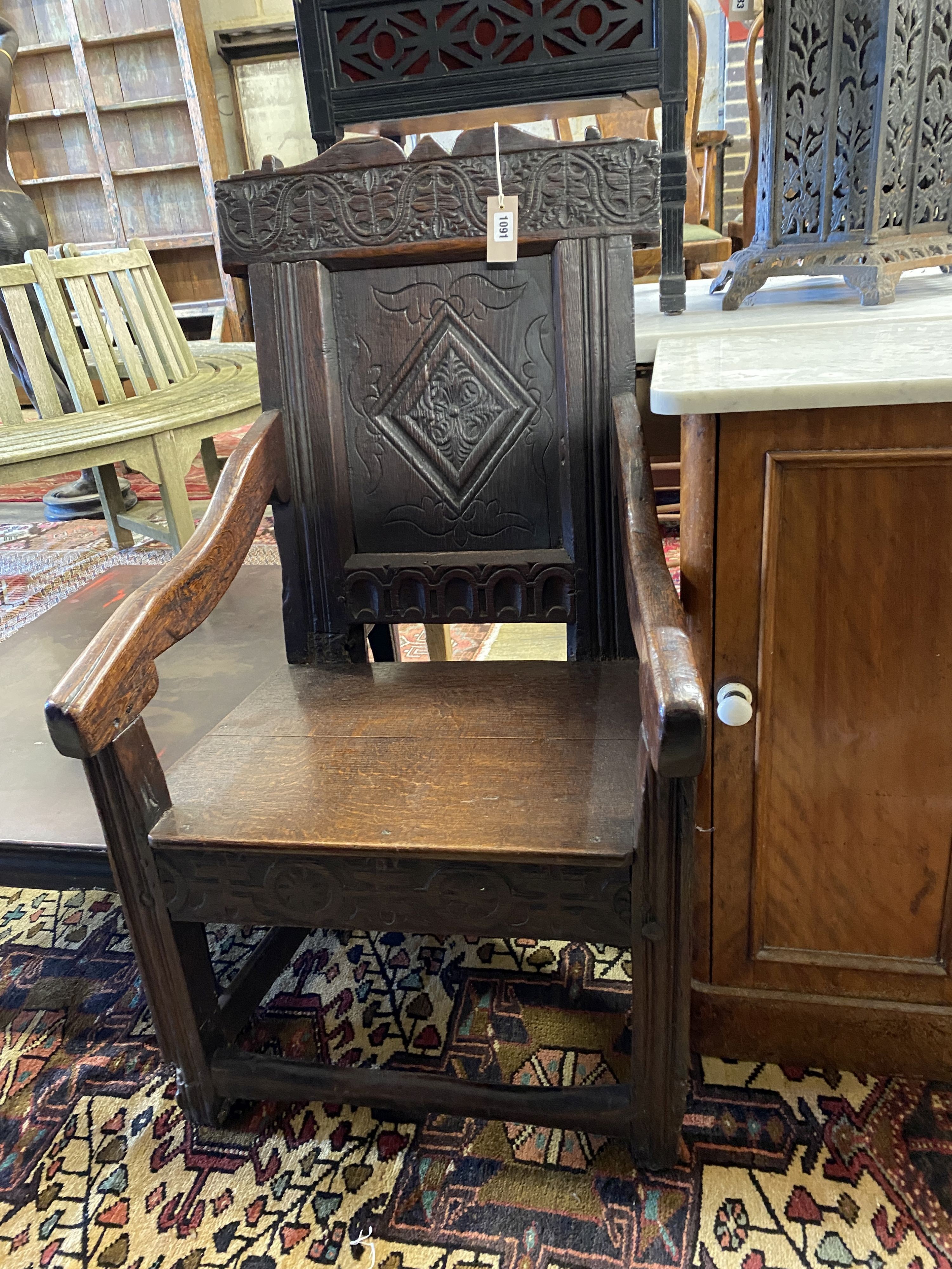 A 17th century and later oak wainscot chair, width 56cm, depth 54cm, height 100cm